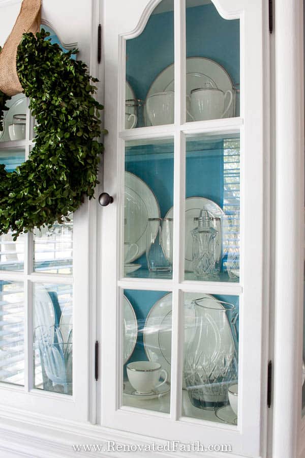 white china cabinet with blue interior