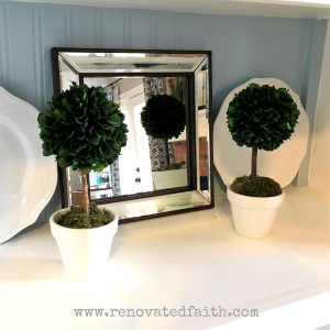 DIY Boxwood Topiary Trees - If you have sticker shock from the boxwood topiary trees sold in stores, here is my tutorial on how to make artificial boxwood topiary trees that are more durable, just as life-like and a fraction of the cost as the ones online. How to Make a Topiary Ball Tree. #topiarytrees #boxwooddecor #boxwoodballs #diyoutdoortopiary #topiaryballs
