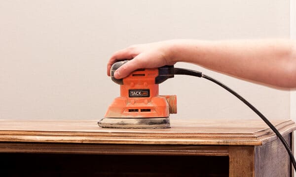 sanding furniture top with sander