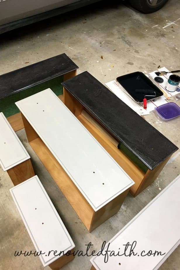 drawers of a dresser being painted