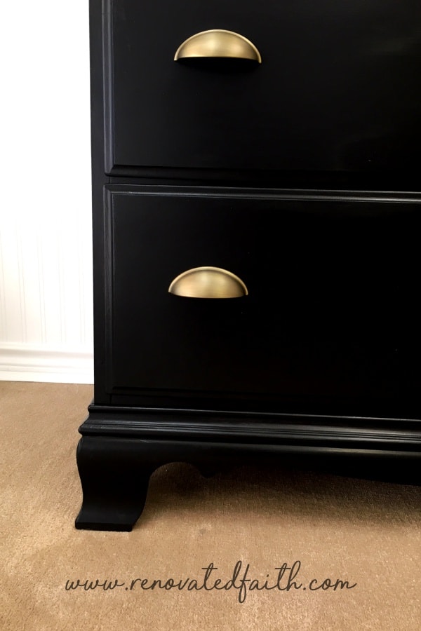 black dresser with gold pulls
