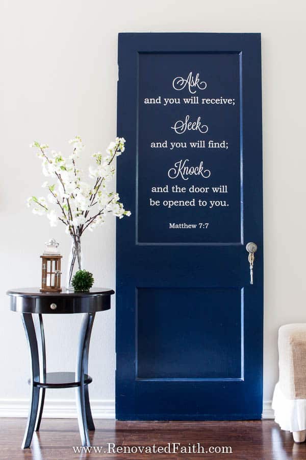 navy door with Bible verse