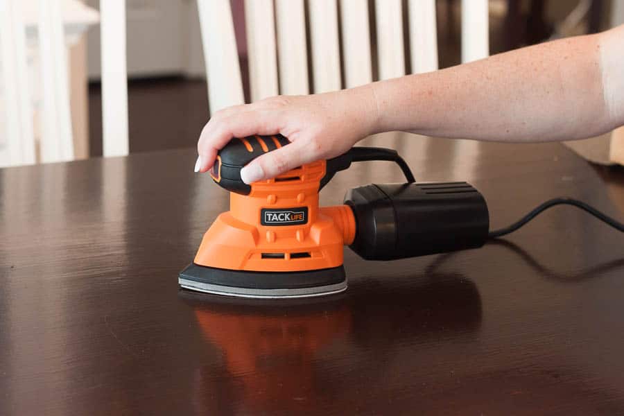 Small hand sander for outlet wood