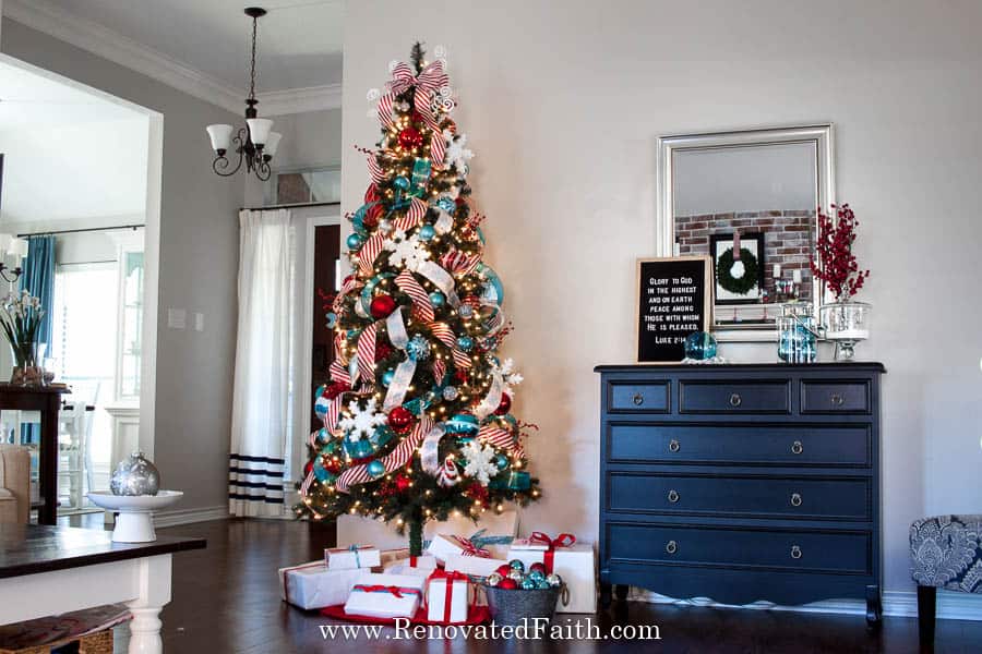 Decorate a Christmas Tree-Step by Step Tutorial – Step 2 made all the difference!  Ideas on how to decorate and add ribbon to a Christmas tree on a budget.  Decorate your tree like a pro in just a few easy steps.  Works with mesh, garland, tulle and ribbon, even burlap for a beautiful tree through the holidays!  #christmastree #christmasdecor