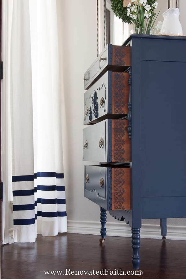 blue dresser with lace stenciled drawers