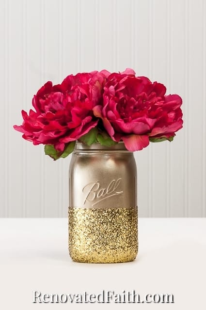 gold spray painted jar with flowers