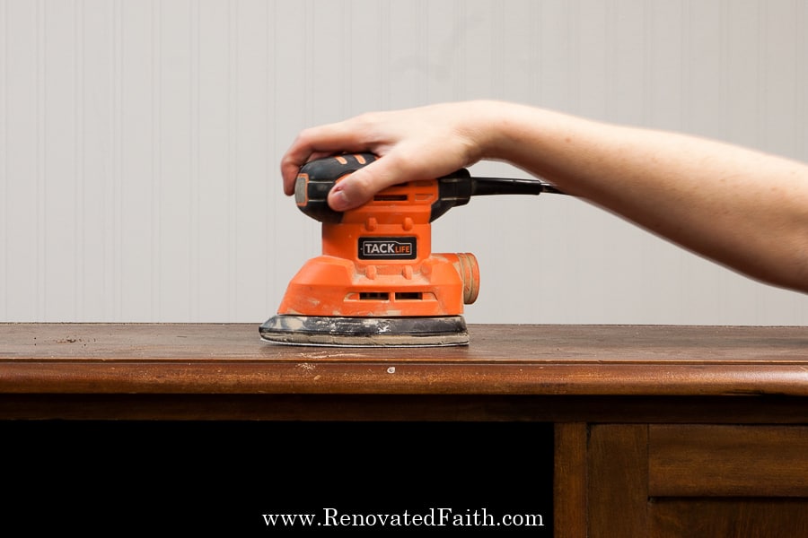 sanding furniture with a sander