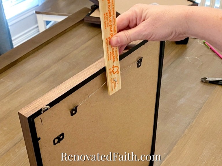 How To Hang Multiple Pictures On A Wall Evenly (Easy Hack!)