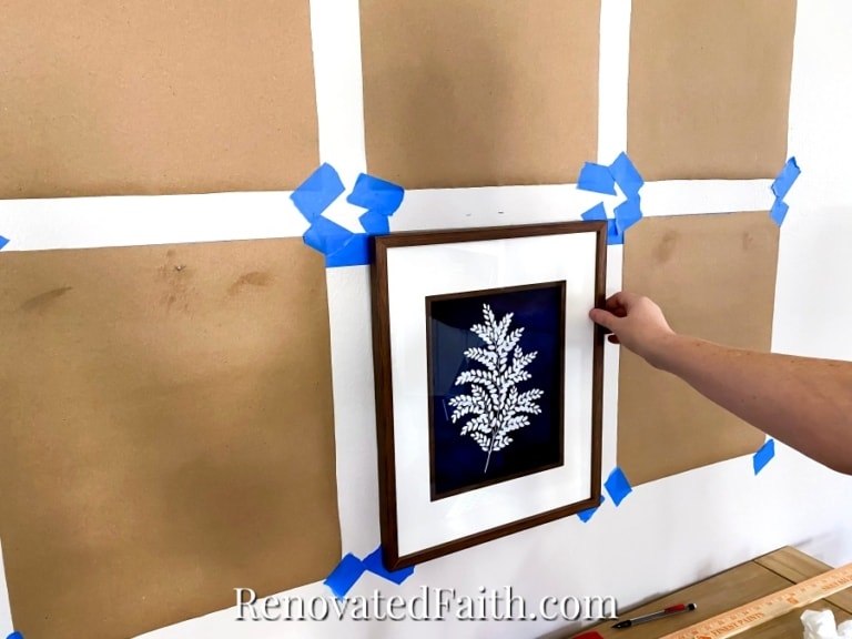 How To Hang Multiple Pictures On A Wall Evenly (Easy Hack!)