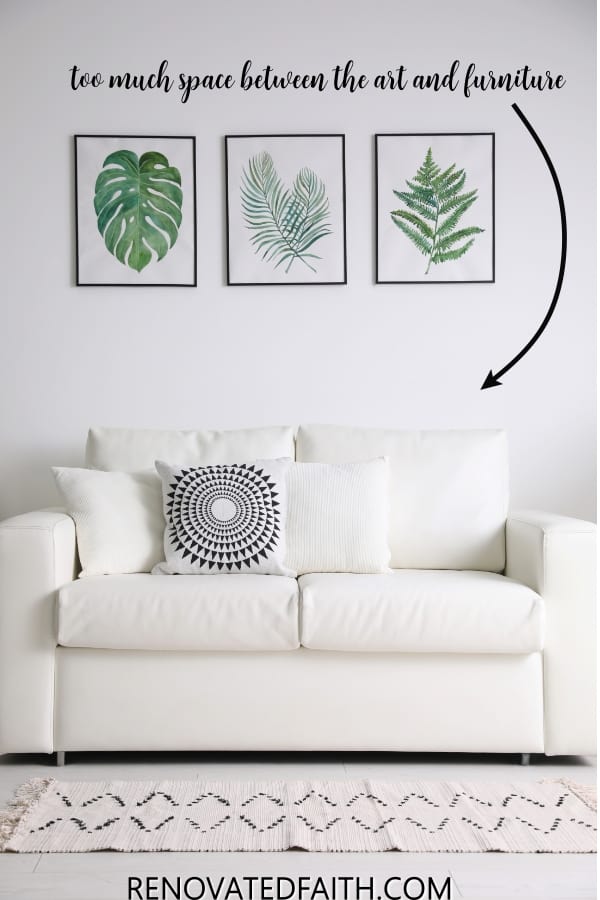 Hang three pictures on a clearance wall