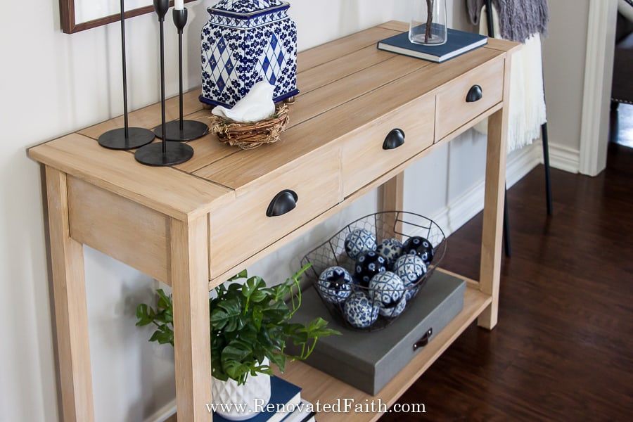 raw wood finish on console table
