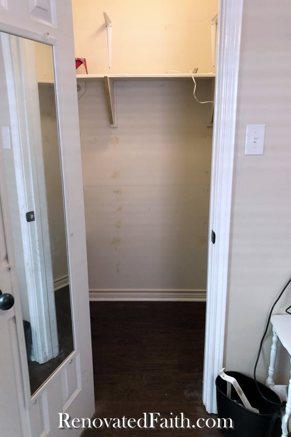 before of walk in closet with desk