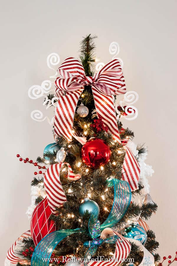 easy christmas tree topper in red and white ribbon