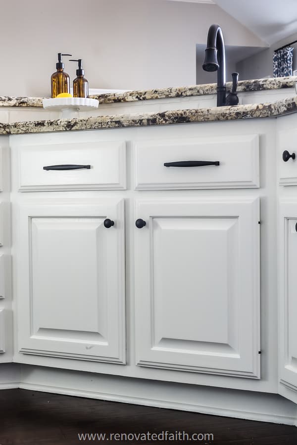 kitchen cabinets in front of sink