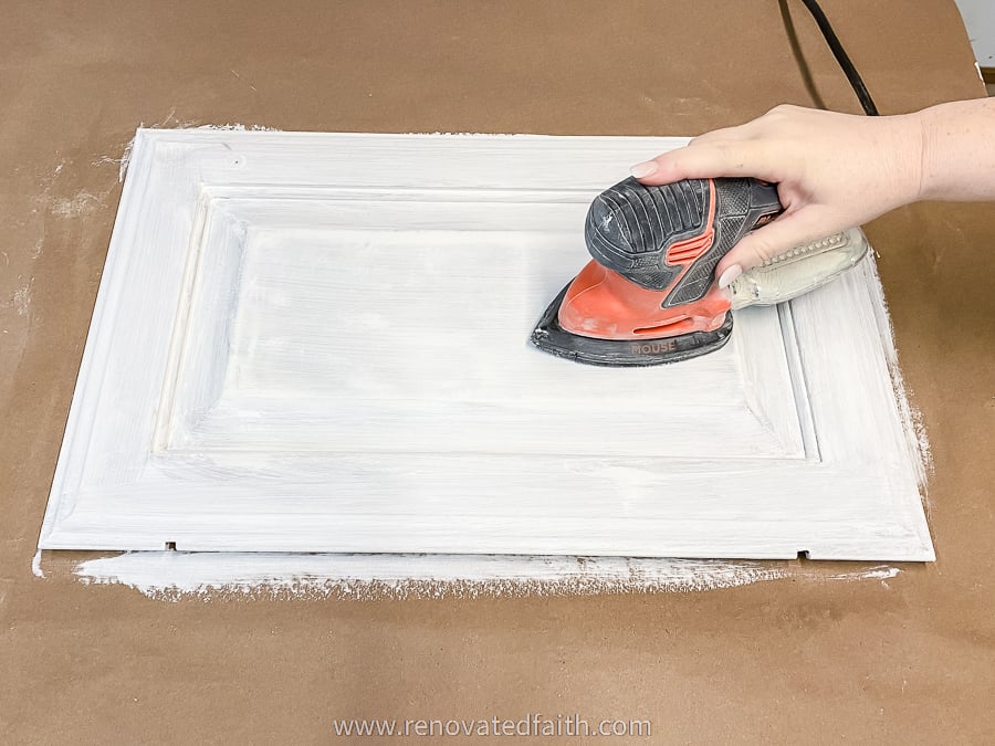 sanding paint with electric sander