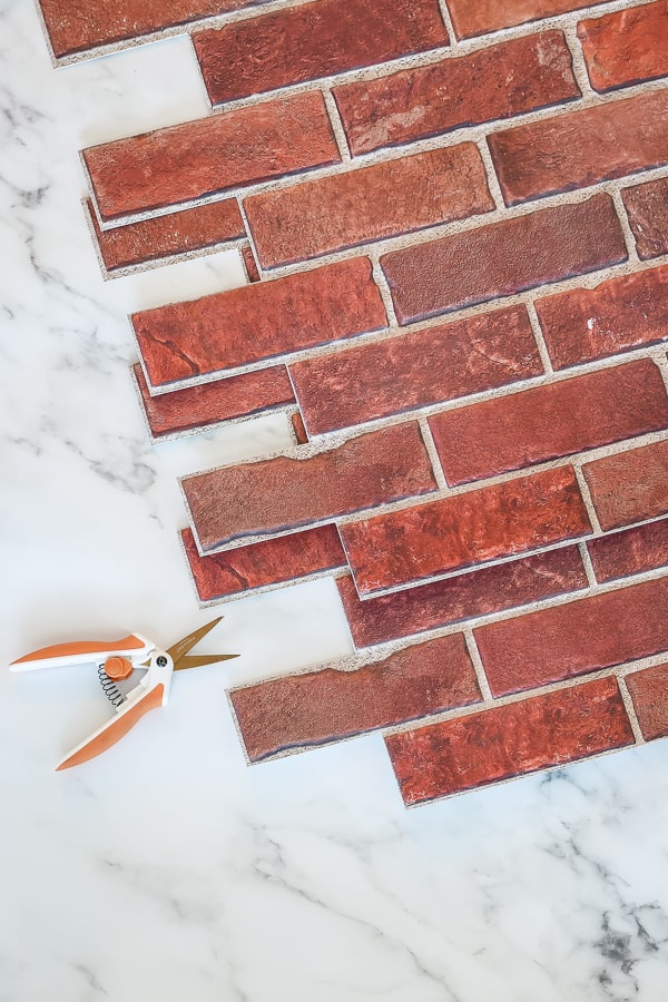 brick pvc backsplash panels and scissors