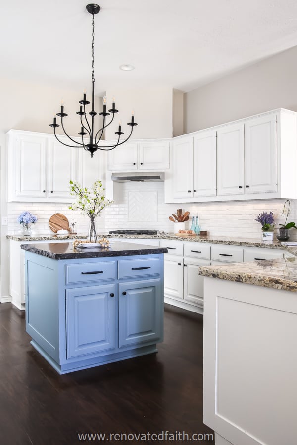 alabaster white ktichen cabinets with blue island