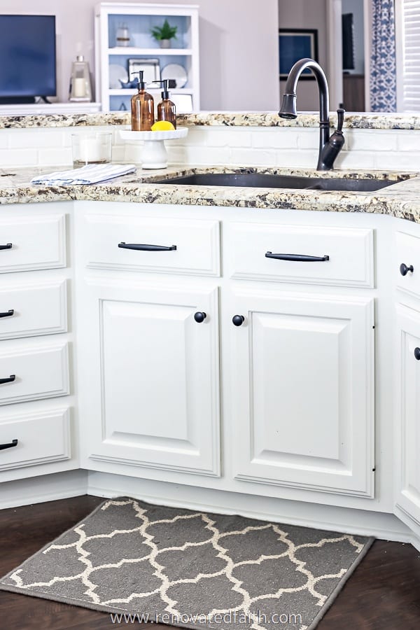 cabinets after being painted, under sink