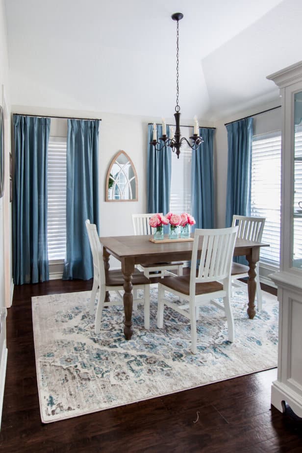 dining room with blue curtains