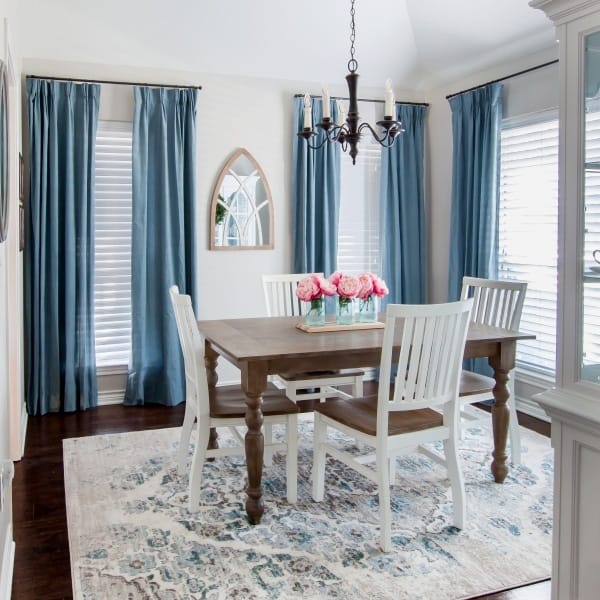 dining room with blue curtains