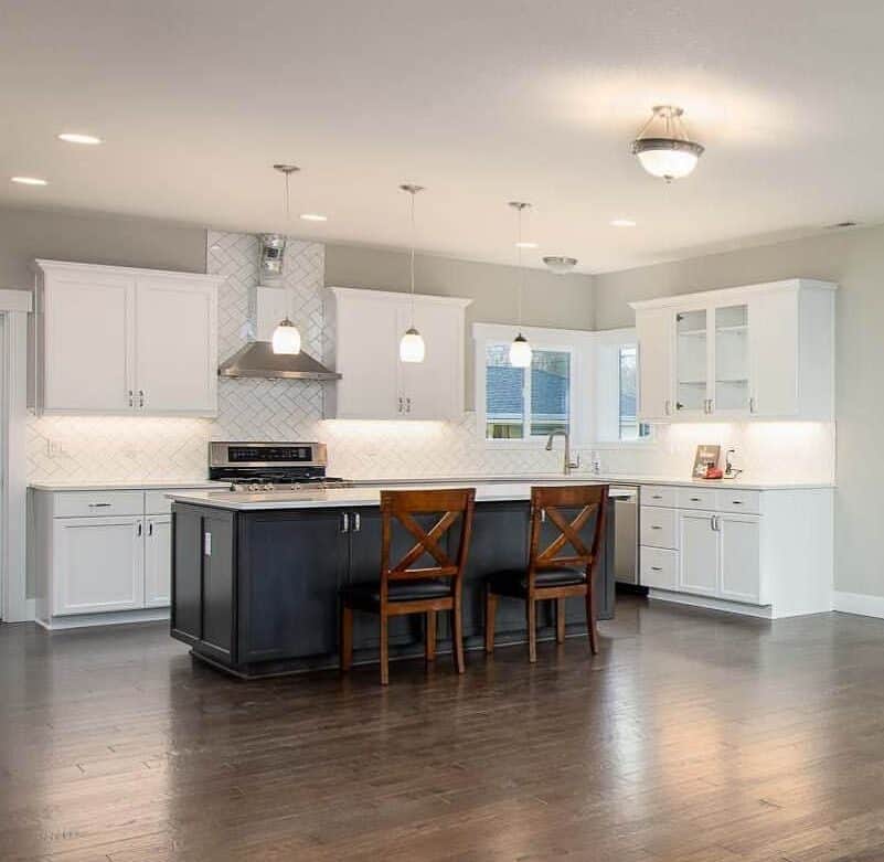 kitchen in sherwin williams extra white with dark island