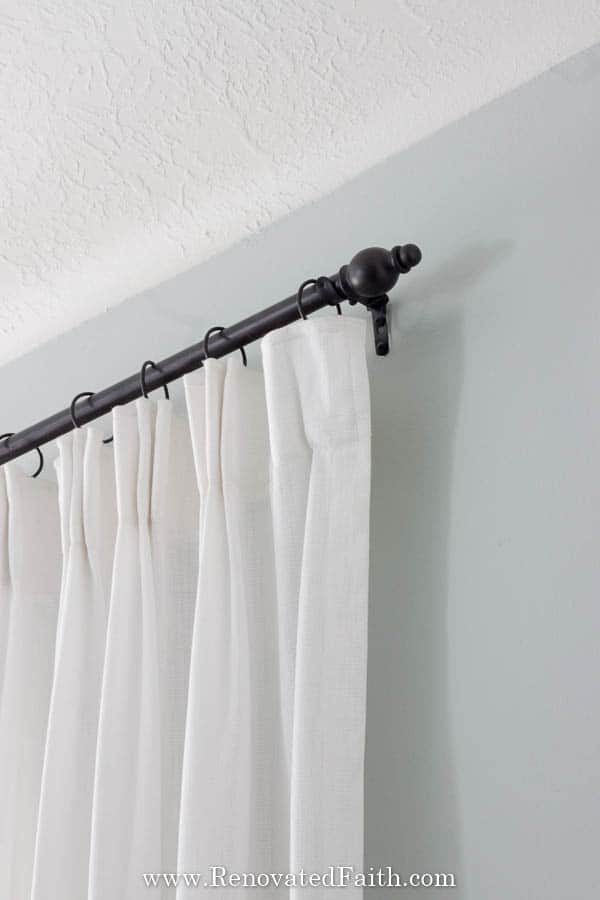 white pinch pleat curtain with gray walls