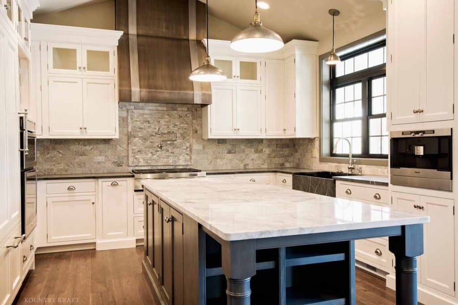 white dove kitchen cabinets with dark blue island