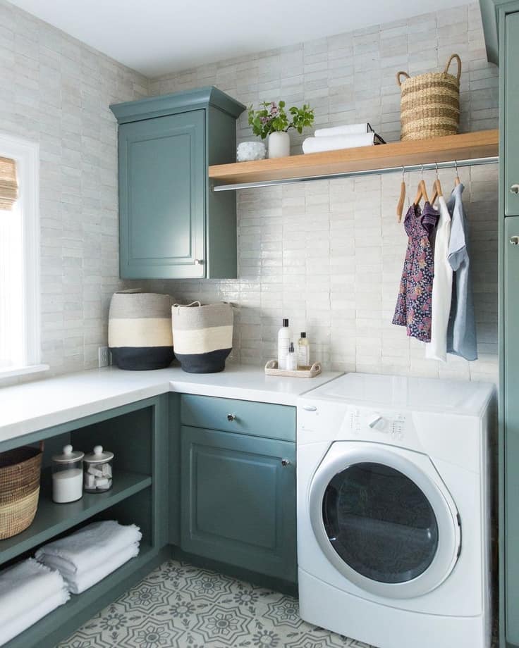 laundry room with blue gray cabinets