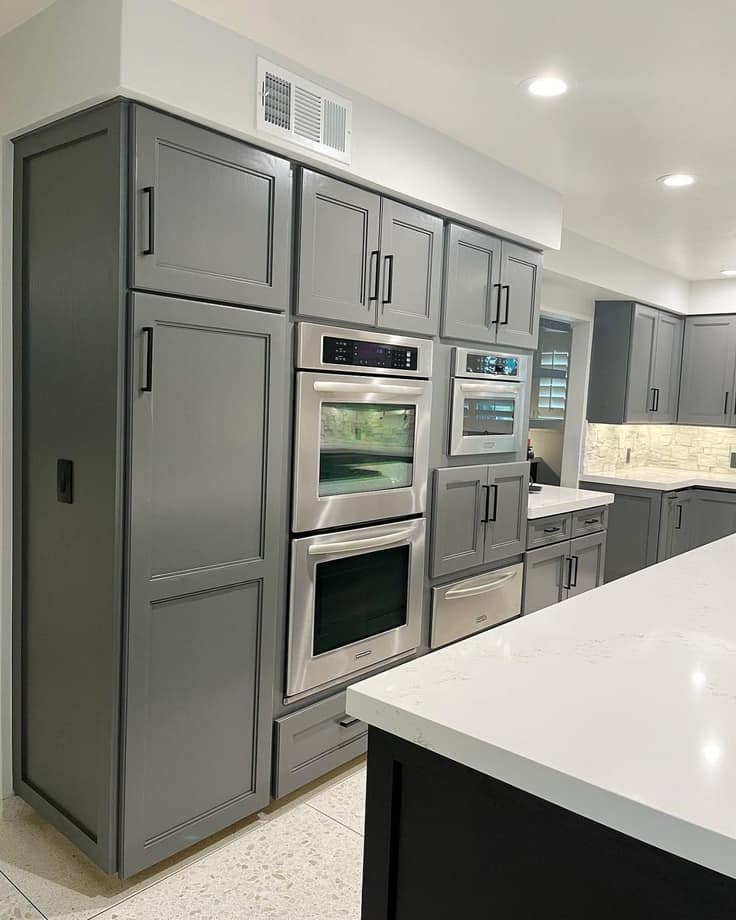 dark gray cabinets with white countertops