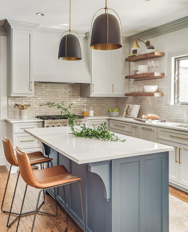 kitchen with blue island and leather bar stools