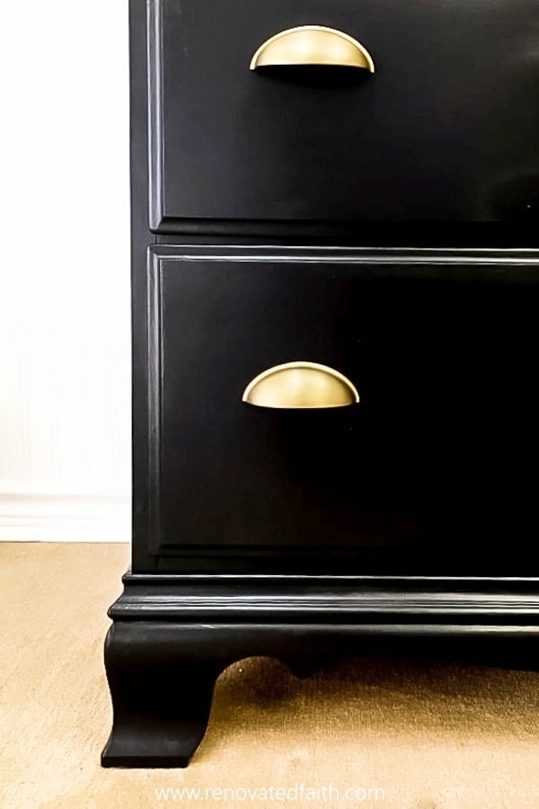 black dresser with gold hardware