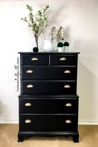 black dresser with gold handles