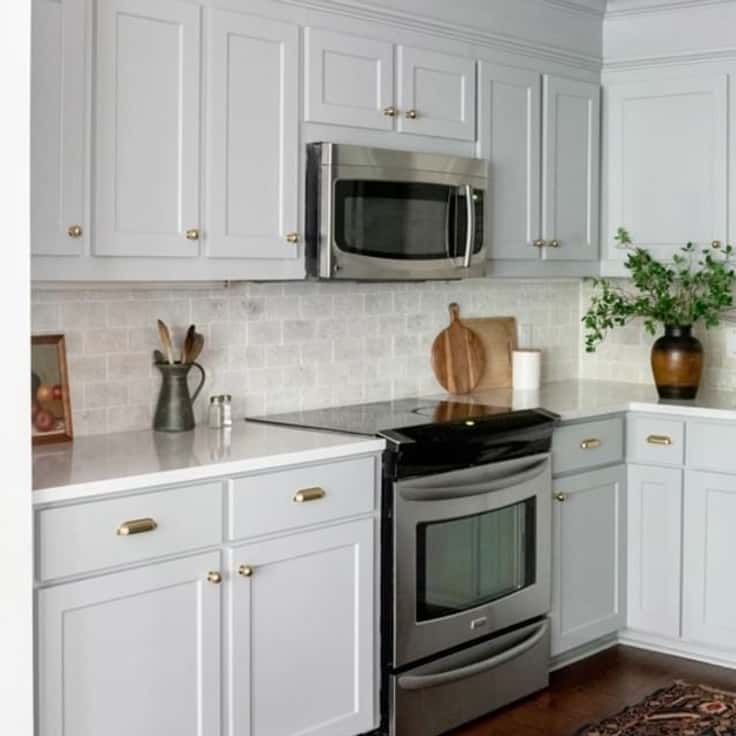 light blue gray kitchen cabinet color with white counters
