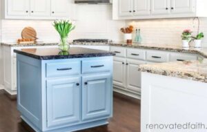 white kitchen with blue island