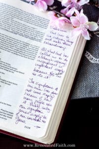 open bible with writing and flowers