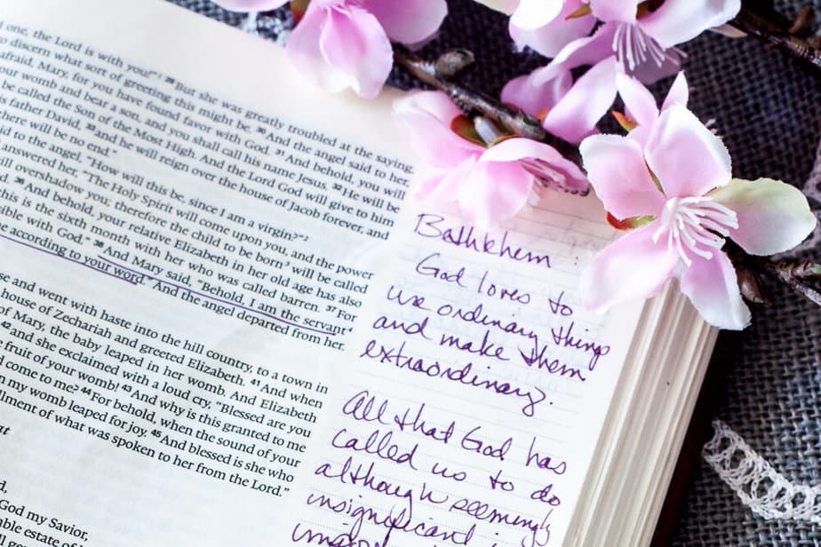open bible with writing and flowers