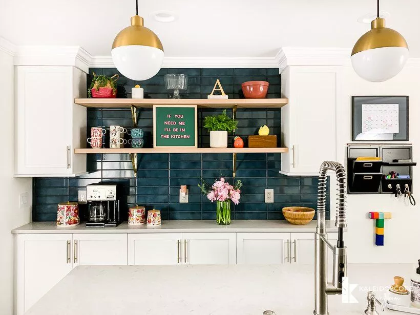 white kitchen with blue backsplash