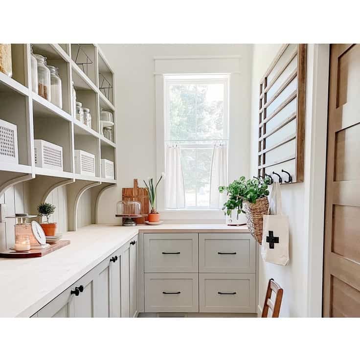 laundry room with greige cabinets
