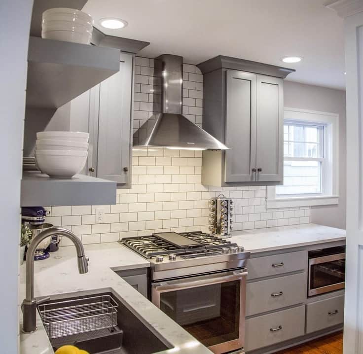 gray kitchen cabinets with white backsplash