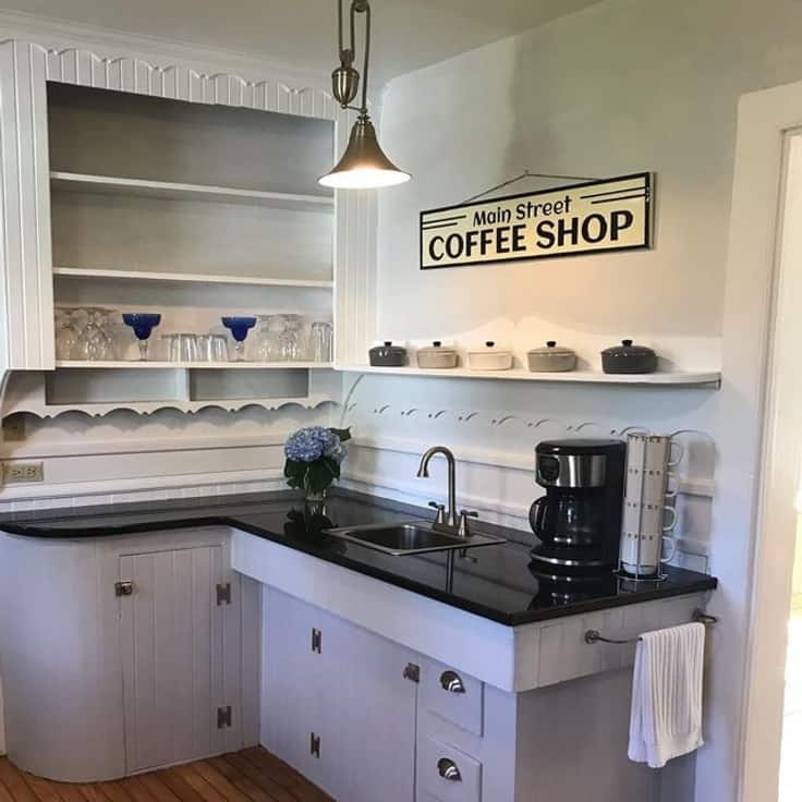 small kitchen with gray lower cabinets