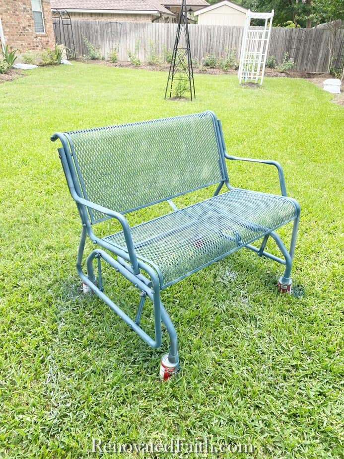 blue wrought iron glider spray painted