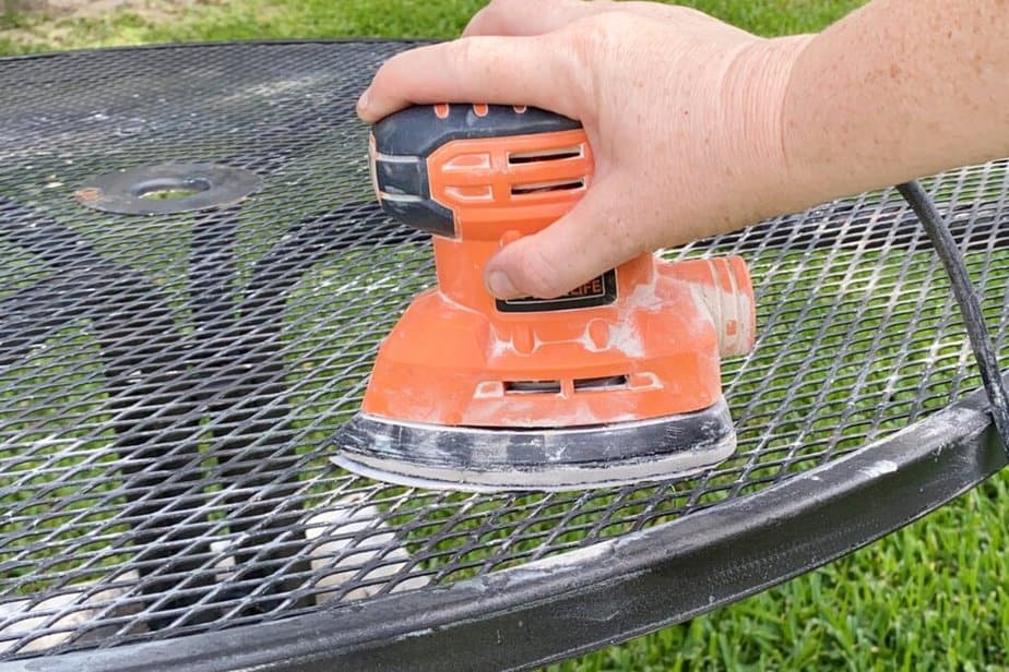 sanding outdoor metal table before spray paint