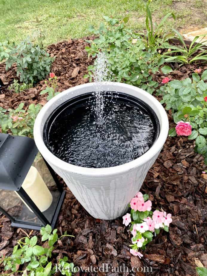 top of fountain in yard