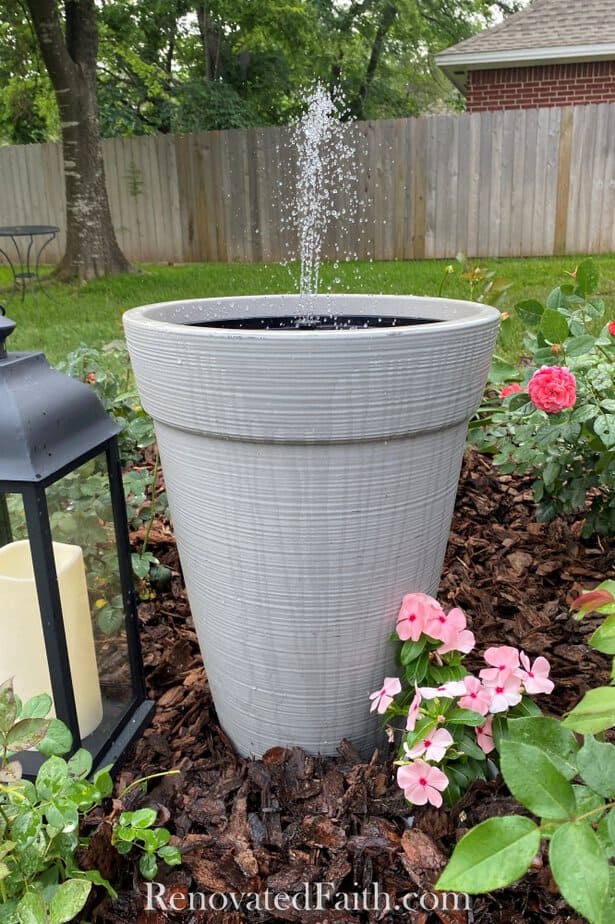 gray water fountain in yard